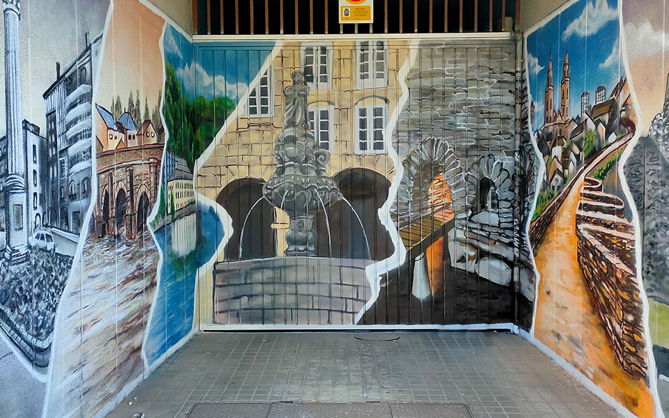 Graffiti en un garaje de varios lugares de interés de Lugo